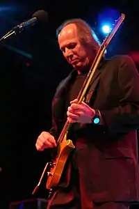 Adrian Belew plays electric guitar