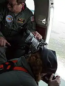 USGS aerial photography crew gathers data following the landfall of a hurricane.