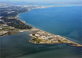 Aerial photograph of an urban shoreline along a bay