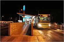 Bus arriving at a station in the Ahmedabad Bus Rapid Transit System