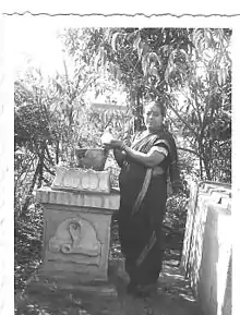 A woman from Maharashtra watering tulasi in 1970s.