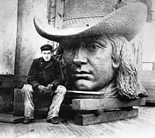 Tacony Iron Works employee, 18-year-old Frederik Ullberg with the head of Alexander Milne Calder's statue of William Penn.