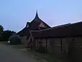 Amaravati Monastery Cloister outside wall and temple in background