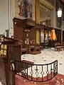 Ambo and Bishop's Cathedra, with his Coat of Arms above