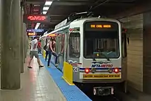 Passengers entering a subway train