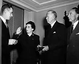 Anna M. Rosenberg being sworn in as Assistant Secretary of Defense by Felix Larkin (left), General Counsel of the Department of Defense. General George Marshall (second from right) and Robert A. Lovett (right), Deputy Secretary of Defense, witness. 15 November 1950.