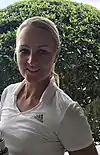 Pro golfer Anna Nordqvist wearing a johnny collar polo at an LPGA tournament