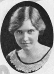 A young white woman with fair hair in a bobbed style, in an oval frame