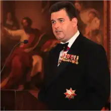 Anthony Bailey (with infrequent orders and medals) speaks at Faith in Sport Olympic Gala Dinner in London, United Kingdom (2012).