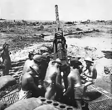 Anti-aircraft gunners wearing fiber helmets at Cape Torokina during the Bougainville campaign