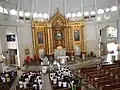 Nave and sanctuary of the cathedral, with a funeral in progress.