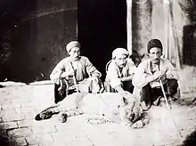 Men with a live lion in Iran.