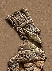 Depiction of a crown-wearing king, naked, imprisoned by Anubanini. This is possibly a feathered crown as seen on some bronzes of Luristan.