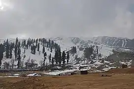 A large, snow-clad mountain ridge