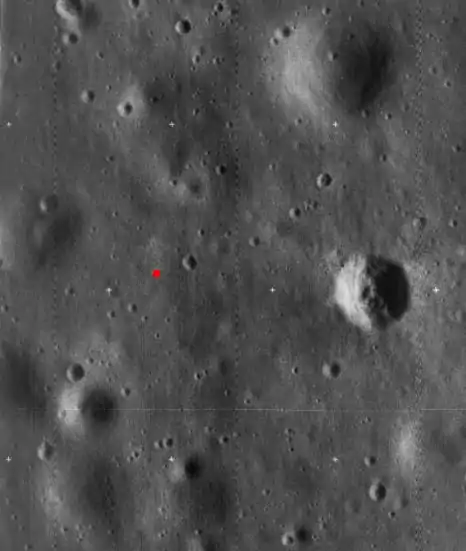 High-resolution Lunar Orbiter 5 image cropped to show the landing site of Apollo 11.  The landing site is indicated by a red dot.  The prominent crater at right is called West crater and is about 190 m in diameter.