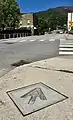 Appalachian Trail marker embedded in sidewalk