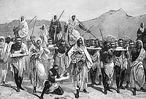 A depiction of slaves being transported across the Sahara desert