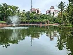 Fountain, arbour, and palm tree in Parimal Garden