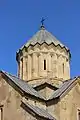 Church drum with a conical umbrella type dome.