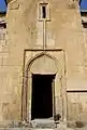 Southern façade and portal to the church.