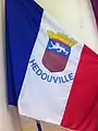 A flag with the coat of arms of Hédouville