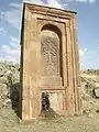 Huge 13th-century khachkar monument located behind the church across the small ravine.