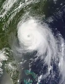 A visible satellite image of a well-formed hurricane, with multiple spiral bands and an eye, nearing landfall in North Carolina on July 3, 2014.