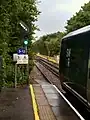 A departing train is signalled onto the line to Ascot.