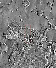 THEMIS image of wide view of following HiRISE images.  Black box shows approximate location of HiRISE images.  This image is just a part of the vast area known as Aureum Chaos.  Click on image to see more details.