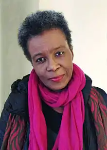 Claudia Rankine wearing a fuchsia scarf