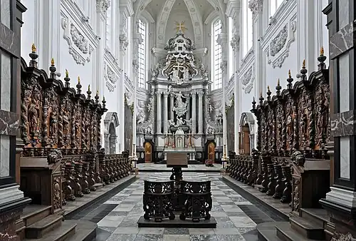 Image 6Averbode AbbeyPhotograph credit: Marc RyckaertAverbode Abbey is a Premonstratensian abbey in Averbode, in the municipality of Scherpenheuvel-Zichem, Belgium. The abbey was founded about 1134, suppressed in 1797, and re-established in 1834. The church is a synthesis of Baroque and Gothic architecture, with Renaissance ornamental details, and dominates the monastery complex; it was built between 1664 and 1672, to a design by the Antwerp architect Jan Van den Eynde II. This view of the church's interior shows the chancel, with the choir in the foreground and the sanctuary in the background.More selected pictures