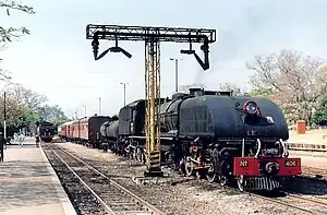 NRZ 15th class No. 406 Ikolo (Hornbill) with a passenger train at Victoria Falls, Zimbabwe, 1997