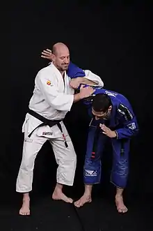 3rd degree black belt professor in brazilian Jiujitsu illustrates the transition to Ude hishigi ude gatame