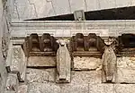 Detail of the stone brackets of the overhang above the gate