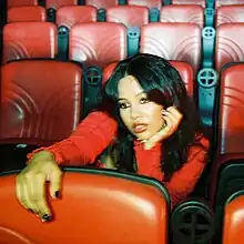 A photo of Rose seated in theater seats