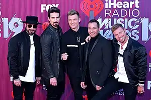 Image 130The American vocal group Backstreet Boys became one of the most commercially successful boy bands of the 1990s. (from 1990s in music)