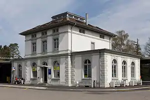 Two-story stone building with hip roof