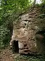 Sandstone outcrop with small caves, near the eastern end of the Upper Pool.