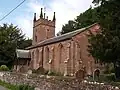 General view of the church from the south east, showing the single pitched roof construction of chancel and nave.