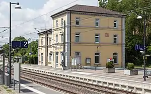 Three-story building with hipped roof