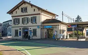 Three-story building with gabled roof