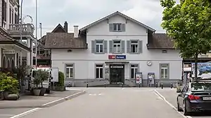 Three-story building with gabled roof