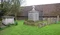 Unusual iron tomb in the churchyard to William Clarkson