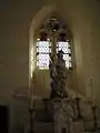 Stained glass and statue in the Church