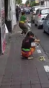 Balinese women attained flower offerings ritual in the morning