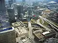 Aerial view from Bank of America Plaza's 46th floor; downtown Atlanta in upper left of photo; I-75/I-85 (the Connector) is the major road artery running under the bridges and near the edges of Baltimore Block at bottom right corner