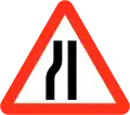 Road narrows on left sides