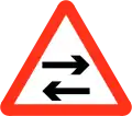 Two way traffic crosses one way road