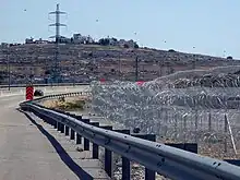 The barbed wire of the Israeli West Bank barrier (Giv'at Ze'ev, May 2010)