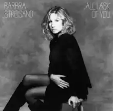 A black and white photograph of Streisand appears along with her name and the song title in white above and below her, respectively.